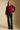 A full body front view of a woman wearing the Saltwater Luxe Finnian Sweater on a neutral background