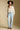 A full body front view of a woman wearing the Saltwater Luxe  Fiorra Sweater on a neutral background