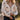 Front view of a woman wearing the Saltwater Luxe  Fiorra Sweater in a natural setting
