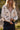 Front view of a woman wearing the Saltwater Luxe  Fiorra Sweater in a natural setting