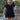 Front view of a woman wearing the Saltwater Luxe Ginna Mini Dress boots on a staircase