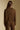 Back view of a woman wearing the Saltwater Luxe Half Zip Seam Pullover on a neutral background with arms lowered