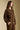 Side angle view of a woman wearing the Saltwater Luxe Half Zip Seam Pullover on a neutral background with hand in pocket