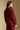 Back view of a woman wearing the Saltwater Luxe Half Zip Seam Pullover on a neutral background with arms lowered
