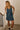 Front view of a woman wearing the Saltwater Luxe Haydin MinI Dress with hands in pockets