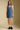Front view of a woman wearing the Saltwater Luxe Haydin MinI Dress on a neutral background with hands at sides