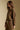 Side angle view of a woman wearing the Saltwater Luxe Idella Pullover on a neutral background with matching pants
