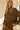 Front view of a woman wearing the Saltwater Luxe Idella Pullover with matching lounge pants and knit cap
