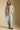Full body front view of a woman wearing the Saltwater Luxe  Ivah Jacket on a neutral background