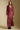 A full body front view of a woman wearing the Saltwater Luxe Jaycee Midi Skirt on a neutral background