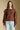 Front  view of a woman wearing the Saltwater Luxe Jeri Sweater on a neutral background with jeans
