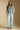 A full body front view of a woman wearing the Saltwater Luxe Joss Sweater on a neutral background