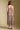 Back view of a woman wearing the Saltwater Luxe Juli Midi Dress on a neutral background