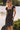 Front view of a woman wearing the Saltwater Luxe Junniper Midi Dress with sunglasses