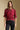 Front view of a woman wearing the Saltwater Luxe Kadie Top on a neutral background with hands at sides of black jeans