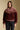 Front view of a woman wearing the Saltwater Luxe Kaira Jacket on a neutral background with hand in pocket