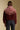 Back view of a woman wearing the Saltwater Luxe Kaira Jacket on a neutral background with arms at sides