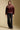 A full body front view of a woman wearing the Saltwater Luxe Kaira Jacket on a neutral background
