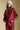 Front  view of a woman wearing the Saltwater Luxe Kevvy Pullover on a neutral background with matching crimson pants
