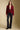 A full body front view of a woman wearing the Saltwater Luxe Klarke Sweater on a neutral background