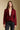 Front view of a woman wearing the Saltwater Luxe Klarke Sweater on a neutral background over white shirt
