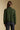 Back view of a woman wearing the Saltwater Luxe Klarke Sweater on a neutral background with pants