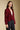 Side angle view of a woman wearing the Saltwater Luxe Klarke Sweater on a neutral background with arms at sides