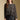 Front view of a woman wearing the Saltwater Luxe Korrie Top on a neutral background with Ralie skirt and arms lowered