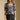 Front view of a woman wearing the Saltwater Luxe  Lemi Top on a neutral background with arms at sides