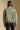 Back view of a woman wearing the Saltwater Luxe Levy Jacket on a neutral background with pants