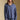 Front view of a woman wearing the Saltwater Luxe Liu Indigo Top on a neutral background with matching pants