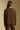 Back view of a woman wearing the Saltwater Luxe Long Sleeve Pullover on a neutral background with arms at sides