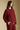 Side angle view of a woman wearing the Saltwater Luxe Long Sleeve Pullover on a neutral background with hand in pocket