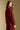 Back view of a woman wearing the Saltwater Luxe Long Sleeve Pullover on a neutral background with arms at sides