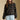 Front view of a woman wearing the Saltwater Luxe Margow Sweater on a neutral background with hands at sides