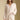 Front view of a woman wearing the Saltwater Luxe Maxine Simple Sweater on a neutral background with hand in pocket