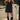 Front view of a woman wearing the Saltwater Luxe Miniya Mini Dress in front of the water