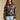 Front view of a woman wearing the Saltwater Luxe Ronnie Sweater on a neutral background with arms at sides