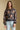 Front view of a woman wearing the Saltwater Luxe Ronnie Sweater on a neutral background with arms at sides