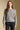 Front view of a woman wearing the Saltwater Luxe Saskia Sweater on a neutral background with jeans