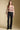 A full body front view of a woman wearing the Saltwater Luxe Slaide Sweater on a neutral background
