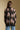 Back view of a woman wearing the Saltwater Luxe Stari Sweater on a neutral background with jeans