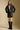 A full body front view of a woman wearing the Saltwater Luxe Sylvie Jacket on a neutral background