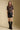 A full body front view of a woman wearing the Saltwater Luxe Tachi Top on a neutral background