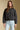 Front view of a woman wearing the Saltwater Luxe Tamira Jacket on a neutral background with bluejeans