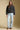 A full body front view of a woman wearing the Saltwater Luxe Tamira Jacket on a neutral background