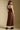 Back view of a woman wearing the Saltwater Luxe Tarynel Maxi Dress on a neutral background