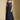 Front view of a woman wearing the Saltwater Luxe Tarynel Maxi Dress on a neutral background with sneakers