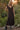 Front view of a woman wearing the Saltwater Luxe Tayler Midi Dress in a garden