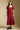Front view of a woman wearing the Saltwater Luxe Tish Midi Dress on a neutral background with hands at sides